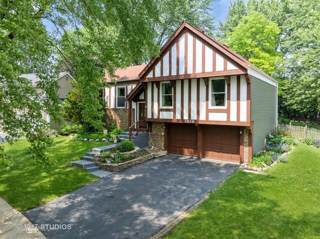 1916 Saginaw Ct, Naperville, IL 60565 - tudor home with brick siding, driveway, and an attached garage