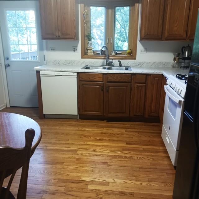 1916 Saginaw Ct, Naperville, IL 60565 - kitchen featuring white appliances, light wood-type flooring, and light countertops
