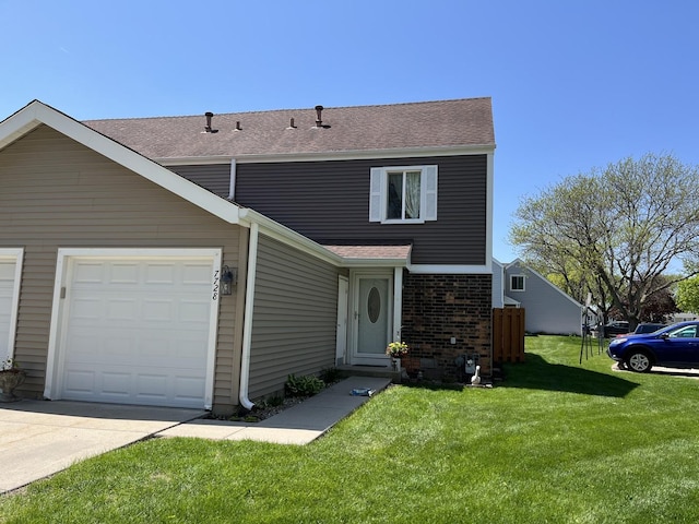 view of front of home featuring an attached garage, a front lawn, roof with shingles, concrete driveway, and brick siding
