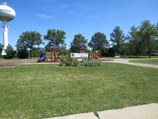 communal playground featuring a yard