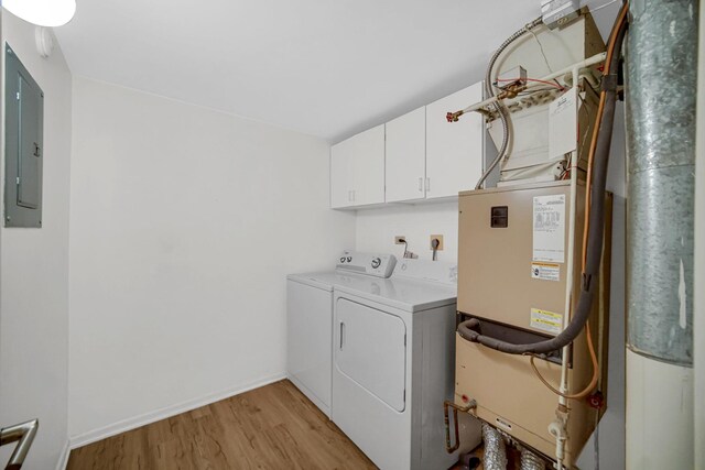 511 Aurora Ave Unit 413, Naperville, IL 60540 - washroom with independent washer and dryer, cabinet space, light wood-style flooring, heating unit, and electric panel