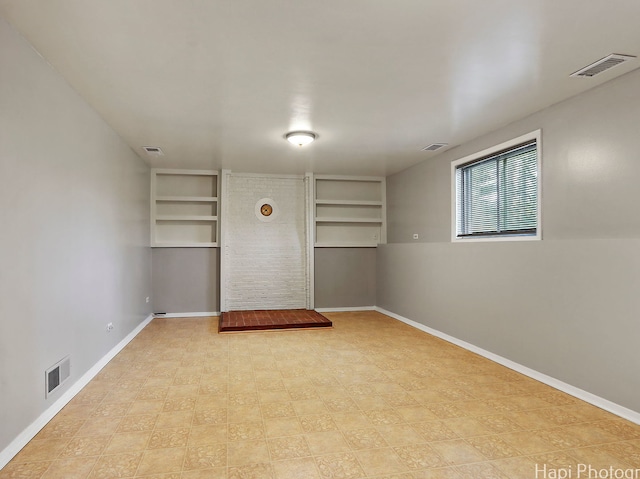 1291 Banbury Rd, Mundelein, IL 60060 - spare room featuring built in features, baseboards, and tile patterned floors