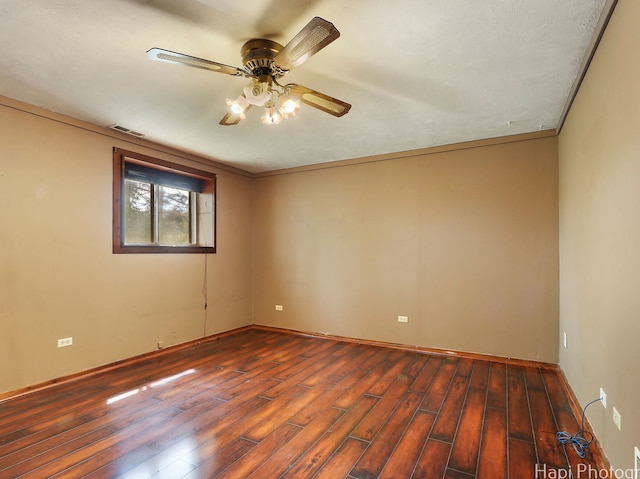 1291 Banbury Rd, Mundelein, IL 60060 - unfurnished room featuring a ceiling fan, dark wood-style floors, and baseboards