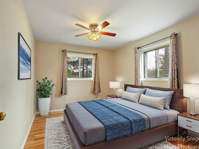 1291 Banbury Rd, Mundelein, IL 60060 - bedroom with multiple windows, light wood-style flooring, baseboards, and ceiling fan