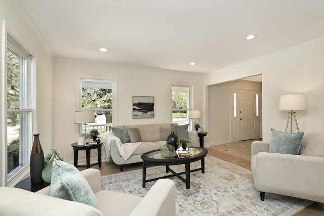 living room with light wood-style flooring, crown molding, baseboards, and recessed lighting