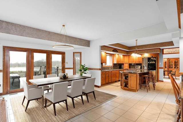 15521 S Mallard Ln, Homer Glen, IL 60491 - dining area featuring light tile patterned flooring and baseboards