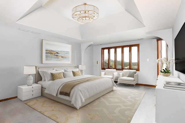 15521 S Mallard Ln, Homer Glen, IL 60491 - bedroom featuring arched walkways, baseboards, a raised ceiling, and carpet
