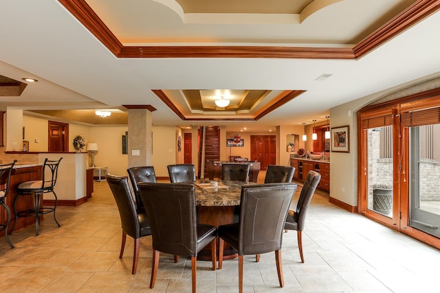 15521 S Mallard Ln, Homer Glen, IL 60491 - dining space featuring a raised ceiling, ornamental molding, light tile patterned floors, and baseboards