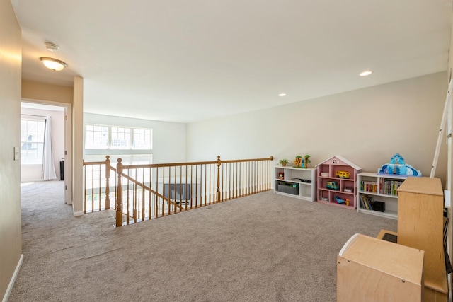 recreation room with carpet floors and recessed lighting