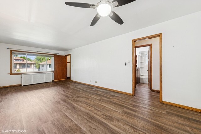 1535 S 56th Ct, Cicero, IL 60804 - unfurnished room featuring radiator, dark wood-type flooring, and a ceiling fan