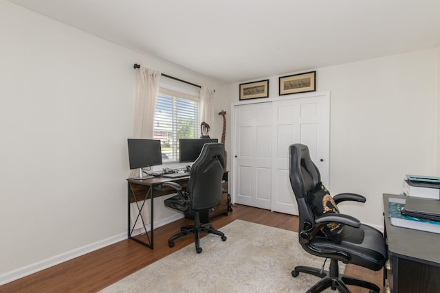 office space featuring wood finished floors and baseboards