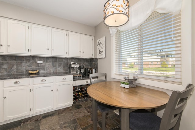dining area with stone finish floors