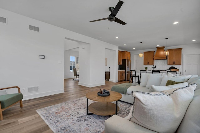 1051 Kinley Dr, New Lenox, IL 60451 - living area featuring a ceiling fan, light wood-style floors, baseboards, and recessed lighting