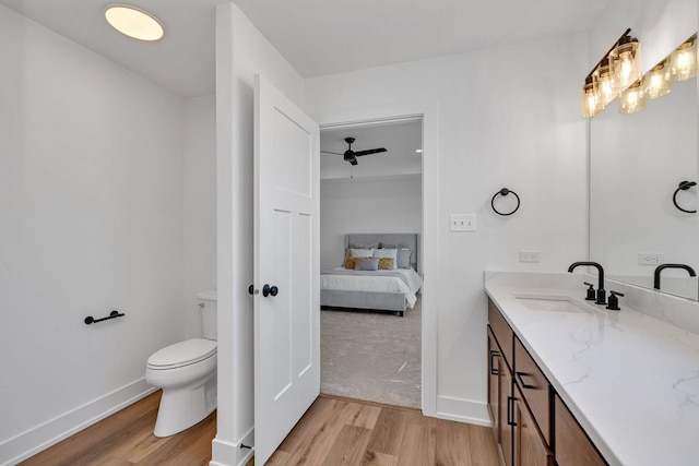 1051 Kinley Dr, New Lenox, IL 60451 - ensuite bathroom featuring wood finished floors, toilet, vanity, and baseboards