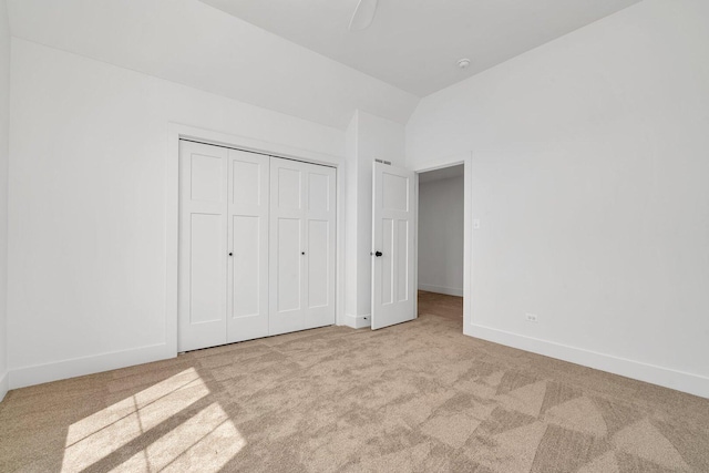 1051 Kinley Dr, New Lenox, IL 60451 - unfurnished bedroom with carpet floors, vaulted ceiling, baseboards, and a closet