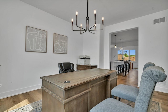 1051 Kinley Dr, New Lenox, IL 60451 - home office with a chandelier, wood finished floors, and baseboards