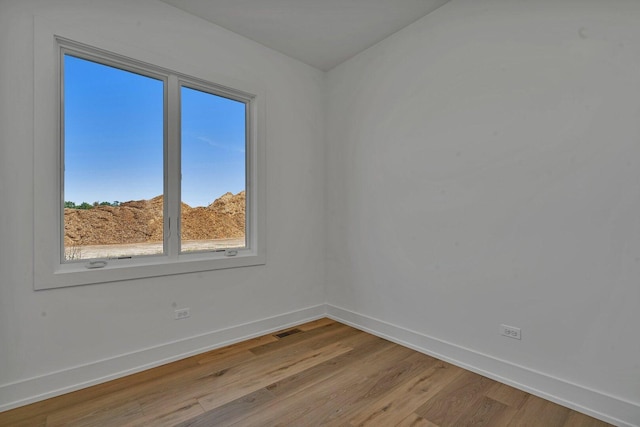 1051 Kinley Dr, New Lenox, IL 60451 - spare room featuring baseboards and light wood finished floors