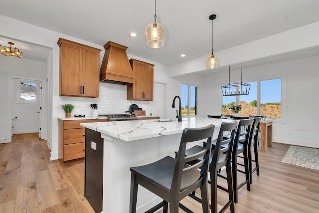 1051 Kinley Dr, New Lenox, IL 60451 - kitchen featuring custom range hood, a sink, light wood finished floors, tasteful backsplash, and recessed lighting