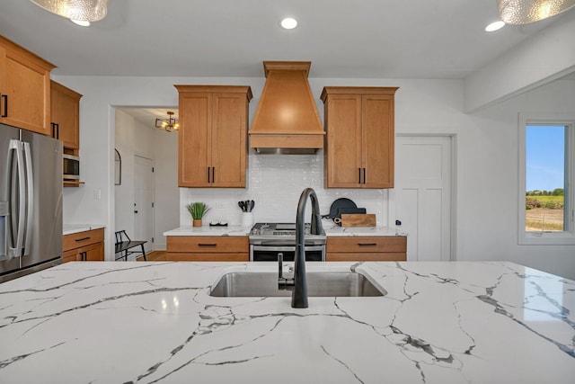 1051 Kinley Dr, New Lenox, IL 60451 - kitchen with premium range hood, brown cabinets, decorative backsplash, and recessed lighting