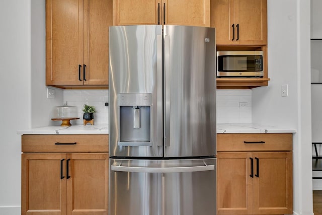 1051 Kinley Dr, New Lenox, IL 60451 - kitchen featuring stainless steel appliances, backsplash, and light stone counters