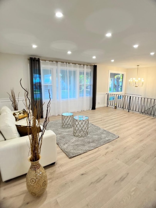 2508 Mitchell Dr, Woodridge, IL 60517 - living room with a chandelier, recessed lighting, wood finished floors, and a wainscoted wall