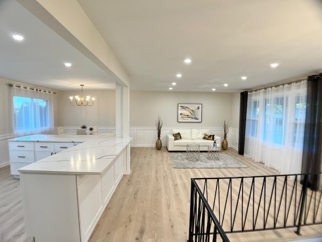 2508 Mitchell Dr, Woodridge, IL 60517 - living area featuring a chandelier, light wood-style floors, a wainscoted wall, and recessed lighting