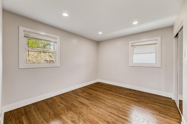 15100 Hamlin Ave, Midlothian, IL 60445 - unfurnished room featuring baseboards, wood finished floors, and recessed lighting