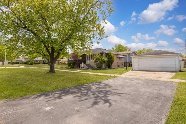 15100 Hamlin Ave, Midlothian, IL 60445 - ranch-style house featuring a front yard and a detached garage