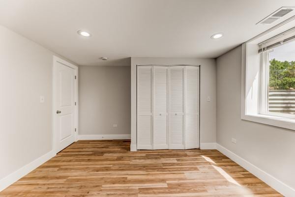 15100 Hamlin Ave, Midlothian, IL 60445 - unfurnished bedroom featuring baseboards, light wood-type flooring, a closet, and recessed lighting