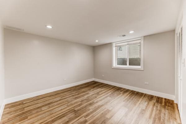 15100 Hamlin Ave, Midlothian, IL 60445 - spare room featuring baseboards, wood finished floors, and recessed lighting