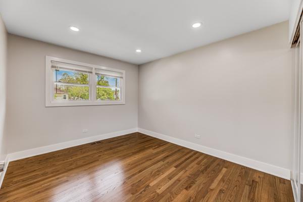 15100 Hamlin Ave, Midlothian, IL 60445 - empty room with baseboards, recessed lighting, and wood finished floors
