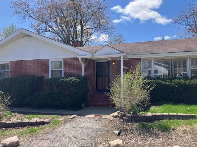 1336 Ardmore Dr, Round Lake Beach, IL 60073 - view of front of house with brick siding and a chimney