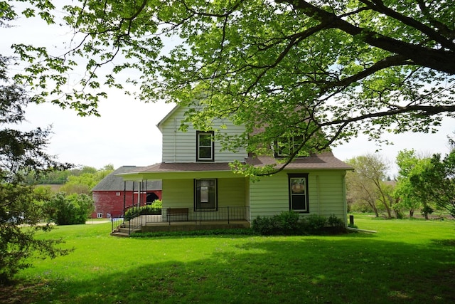 1511 Becker School Rd, Freeport, IL 61032 - back of property featuring covered porch and a yard