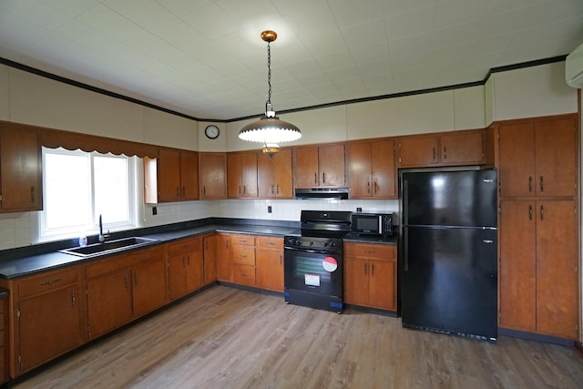 1511 Becker School Rd, Freeport, IL 61032 - kitchen featuring black appliances, a sink, brown cabinets, and dark countertops