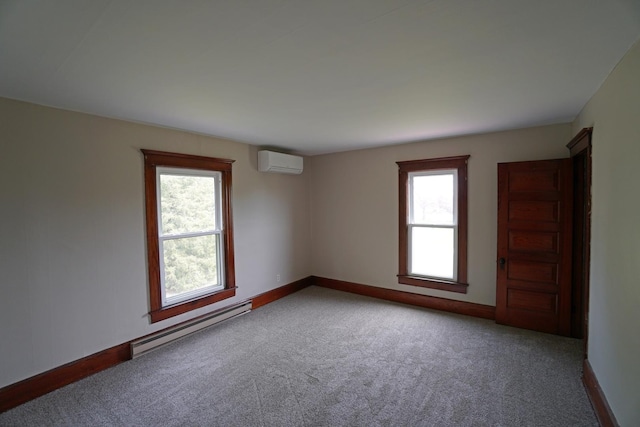1511 Becker School Rd, Freeport, IL 61032 - carpeted empty room with baseboard heating, an AC wall unit, plenty of natural light, and baseboards
