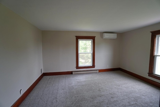 1511 Becker School Rd, Freeport, IL 61032 - empty room featuring a baseboard radiator, a wall mounted air conditioner, carpet flooring, and baseboards