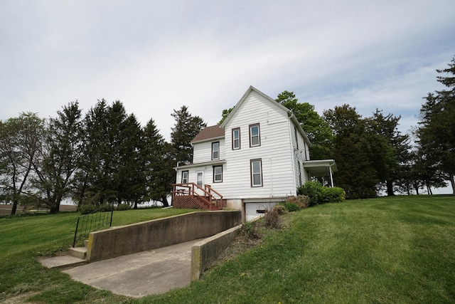 1511 Becker School Rd, Freeport, IL 61032 - back of house featuring a garage, a lawn, and driveway