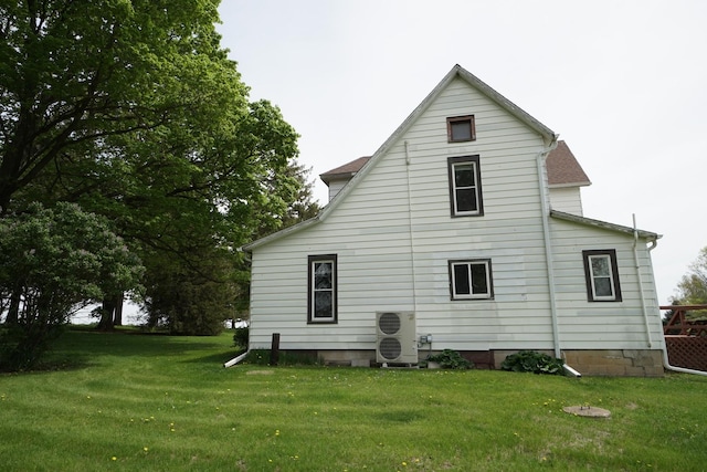 1511 Becker School Rd, Freeport, IL 61032 - back of property featuring a lawn and ac unit