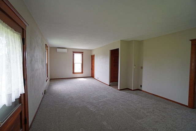 1511 Becker School Rd, Freeport, IL 61032 - unfurnished room featuring carpet, baseboards, and a wall unit AC