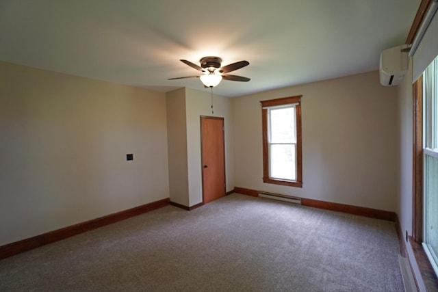 1511 Becker School Rd, Freeport, IL 61032 - carpeted empty room featuring baseboard heating, a wall mounted AC, a ceiling fan, and baseboards
