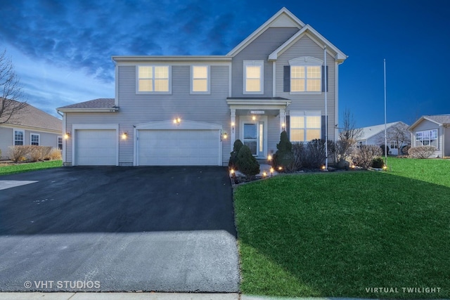 3313 Christopher Ln, Johnsburg, IL 60051 - traditional home with asphalt driveway, an attached garage, and a front yard