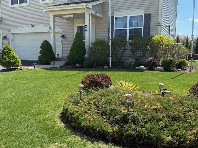3313 Christopher Ln, Johnsburg, IL 60051 - view of green lawn featuring an attached garage