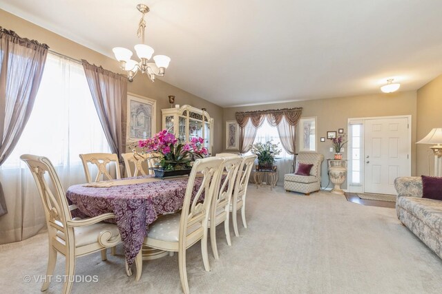 3313 Christopher Ln, Johnsburg, IL 60051 - dining room featuring a chandelier and light colored carpet