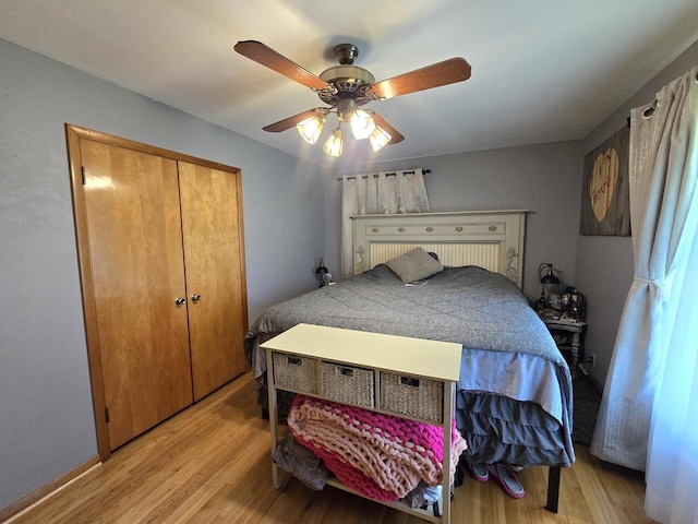 bedroom featuring light wood finished floors and ceiling fan