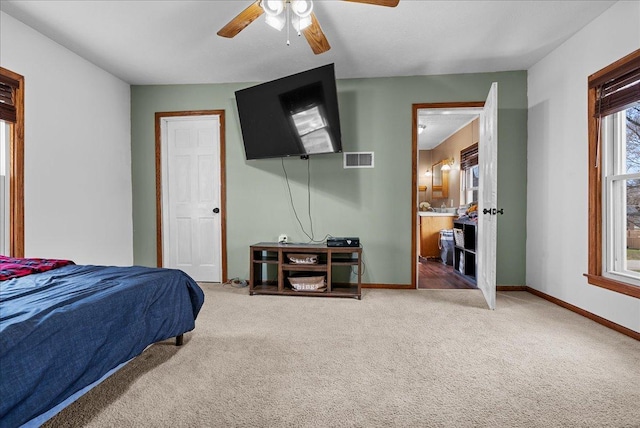 carpeted bedroom with baseboards and ceiling fan