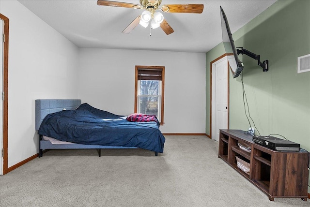 bedroom featuring carpet, baseboards, and ceiling fan