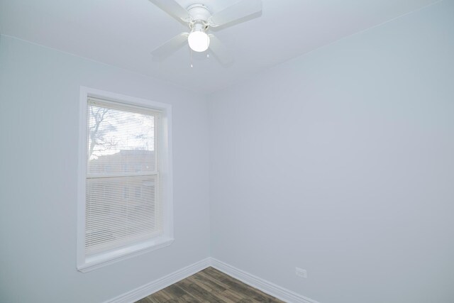 5631 S Throop St, Chicago, IL 60636 - empty room featuring baseboards, dark wood-style flooring, and a ceiling fan