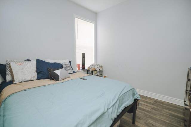 5631 S Throop St, Chicago, IL 60636 - bedroom with wood finished floors, baseboards, and multiple windows