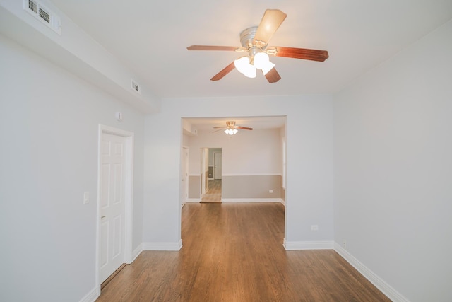 5631 S Throop St, Chicago, IL 60636 - empty room featuring ceiling fan, wood finished floors, and baseboards