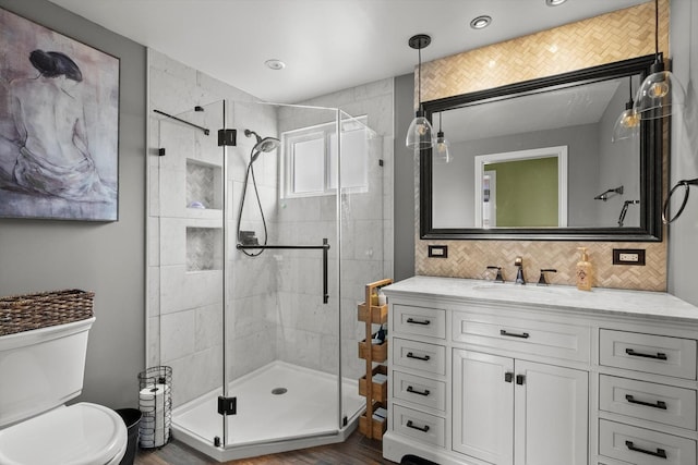 11026 S S Ave H, Chicago, IL 60617 - bathroom featuring a stall shower, toilet, tasteful backsplash, and vanity